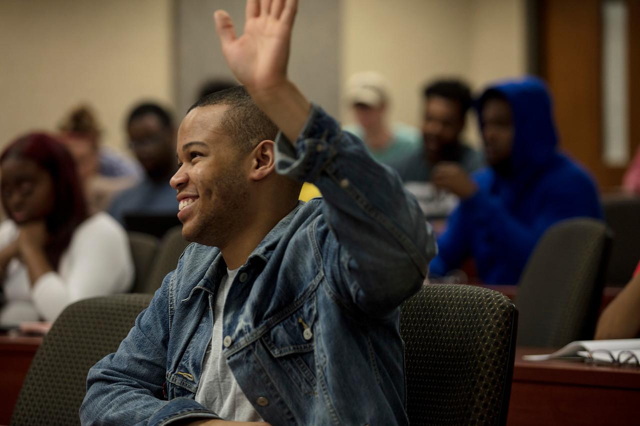 Student with hand raised